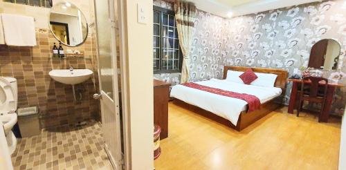 Giường trong phòng chung tại Thanh Thao Dalat Hotel