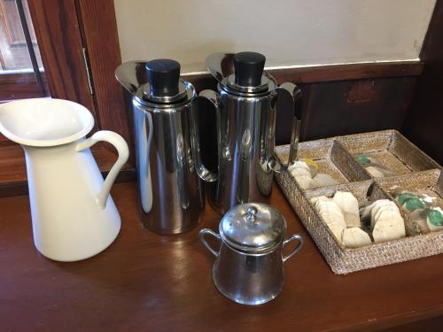 a table with two thermos and a tray of cookies at Villa María in La Laguna