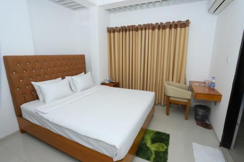 Ένα ή περισσότερα κρεβάτια σε δωμάτιο στο Hotel Blue Castle
