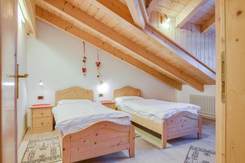 Postel nebo postele na pokoji v ubytování Appartamento Maura