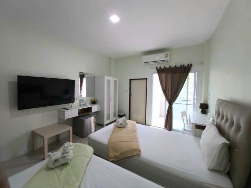 Un ou plusieurs lits dans un hébergement de l'établissement Papangkorn House