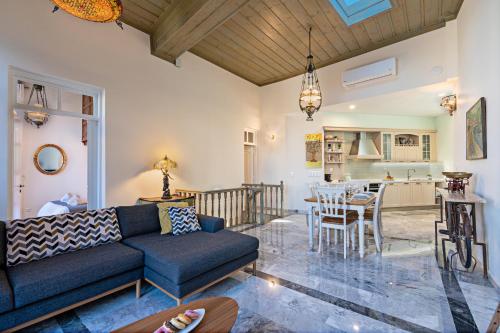 a living room with a couch and a table at StefaniHome in Rethymno Town