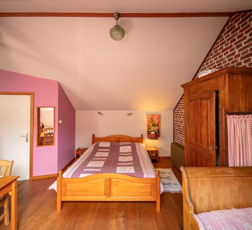 a bedroom with a large bed in a room at B&B Het Loonderhof in Borgloon