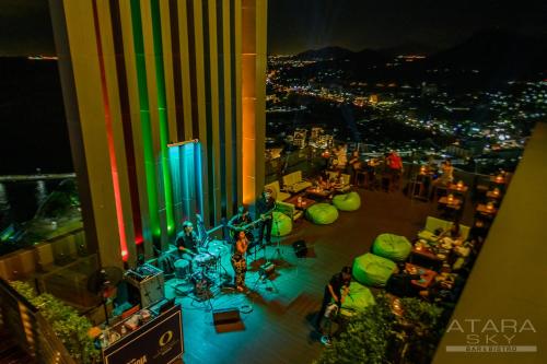 an aerial view of a city at night at Oakwood Hotel & Residence Sri Racha in Si Racha