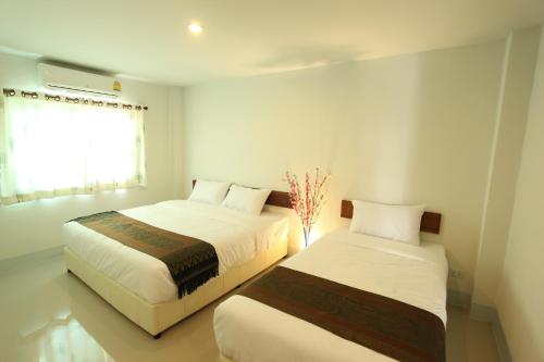 Кровать или кровати в номере Rinlada House