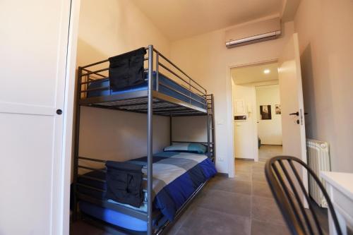 a bedroom with two bunk beds in a room at La casetta di Anastasia in Rome