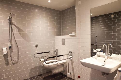 a bathroom with a sink and a toilet and a shower at Holiday Inn Express - Mülheim - Ruhr by IHG in Mülheim an der Ruhr