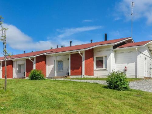 a red and white house with a red roof at Holiday Home Tapiska by Interhome in Taivalkoski