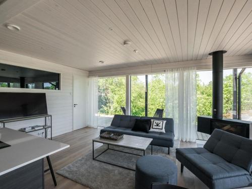a living room with a couch and a table at Holiday Home Kasnäs marina b 16 by Interhome in Kasnäs