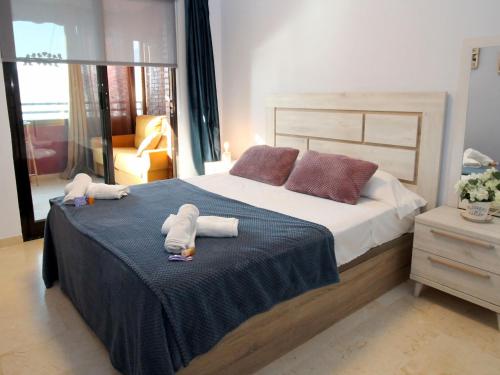 Un ou plusieurs lits dans un hébergement de l'établissement Apartment Trinisol II Playa by Interhome