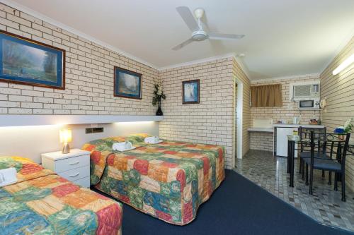 Ένα ή περισσότερα κρεβάτια σε δωμάτιο στο Cara Motel