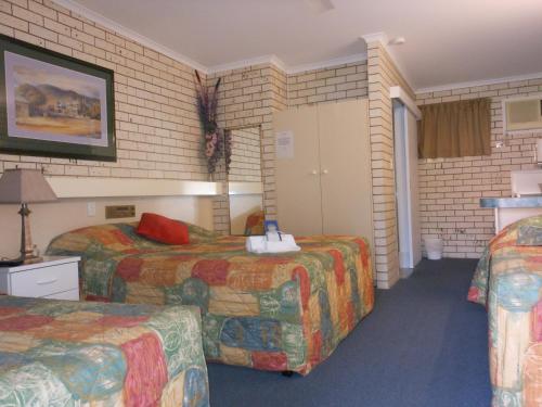Ένα ή περισσότερα κρεβάτια σε δωμάτιο στο Cara Motel