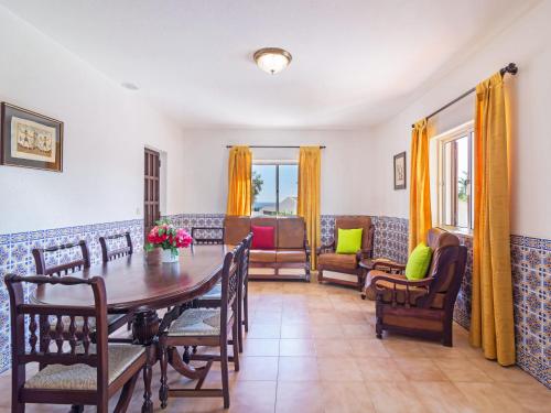 a dining room with a table and chairs at Villa Flor de Maio by Interhome in Patroves
