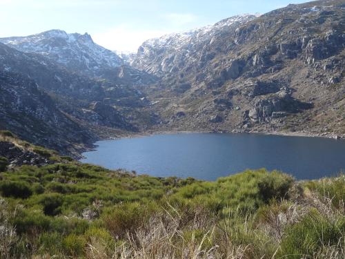 a lake in the middle of a mountain at Los Castaños in Solana de ávila