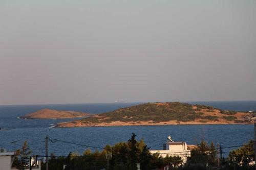 a small island in the middle of a large body of water at Vravrona Sea View Country House near Athens in Vravrona