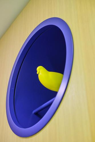 a yellow banana sitting on a blue plate at Vilacrosse Boutique Inn in Bucharest