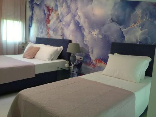 Postel nebo postele na pokoji v ubytování Divine Luxury Apartments