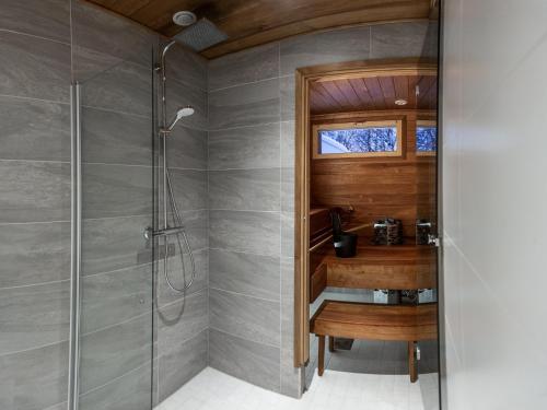 a bathroom with a shower and a sink at Luxury suites Pannunkorva C in Rovaniemi