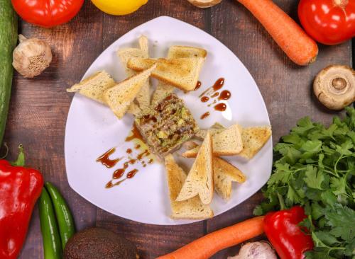 a plate of food on a table with vegetables at Vila 6aTo Hotel & Wellnes in Sofia