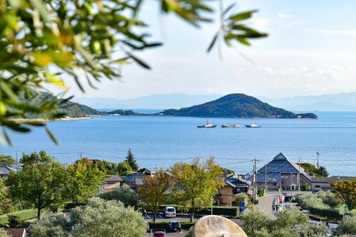 a view of a bay with boats in the water at Sea Tiger Island Inn Shodoshima in Shodoshima