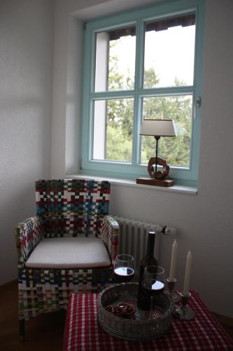 a room with a table and a chair and a window at Berghaus Freiburg - Appartement Hotel auf dem Schauinsland in Oberried