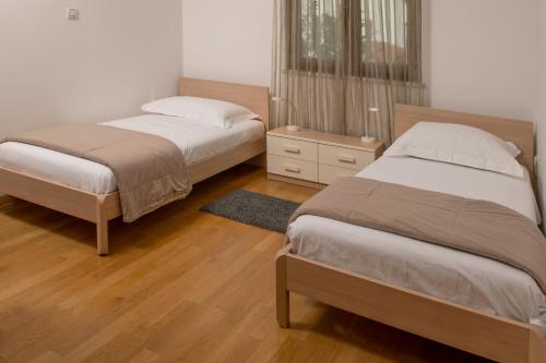 Postel nebo postele na pokoji v ubytování Apartments Oliva