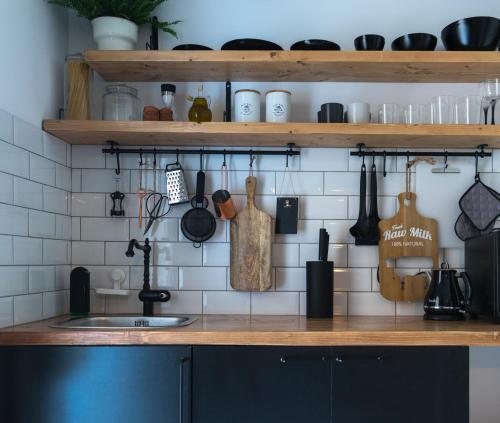 a kitchen with a sink and a counter with utensils at A10 SecretHouse in Athens