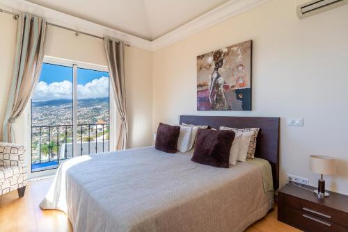 Katil atau katil-katil dalam bilik di Balancal Apartments and Villas Palheiro Village