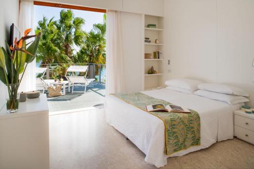 Postel nebo postele na pokoji v ubytování Hotel Caravelle Thalasso & Wellness