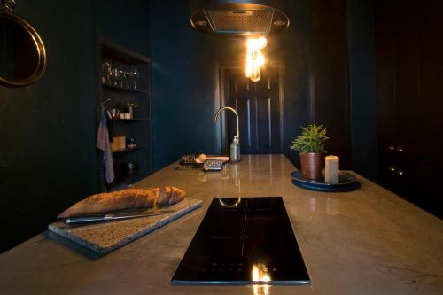 a kitchen with a counter top with a sink at Spirit of Prince Street Hull Old Town in Hull