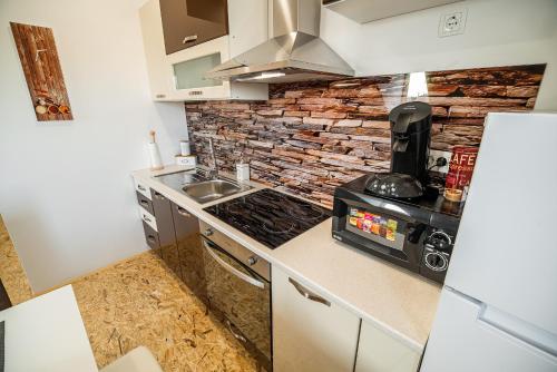 Kuchyň nebo kuchyňský kout v ubytování Apartment A1