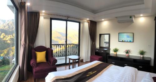a hotel room with a bed and a balcony at Muong Hoa View Hotel in Sa Pa