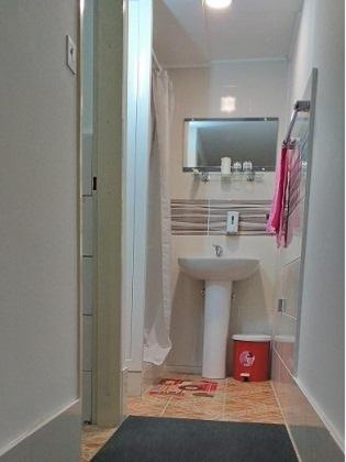 a bathroom with a sink and a mirror at Stefi in Bečej
