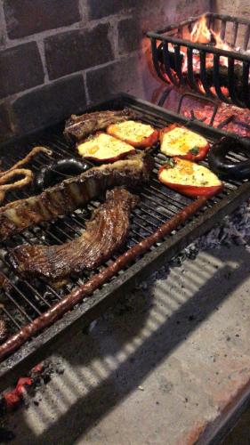 a grill with meat and other food on it at Hotel Europa in Ostende