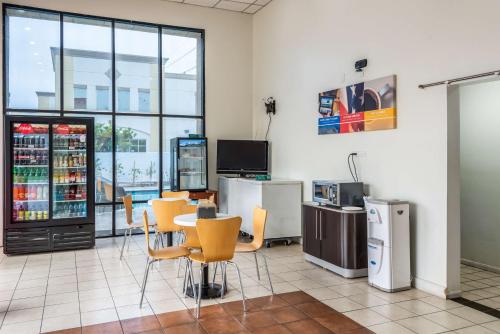 a room with a table and chairs in a store at Motel 6-Gardena, CA - South in Gardena