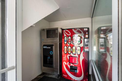 a coca cola vending machine in a building at Motel 6-Lexington, KY - Airport in Lexington