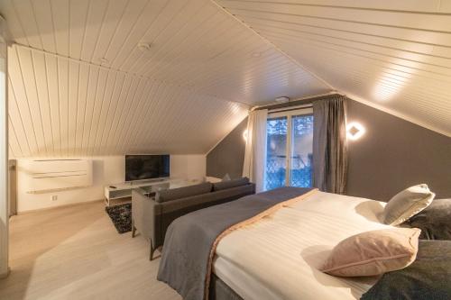 Ένα ή περισσότερα κρεβάτια σε δωμάτιο στο Woikoski Feeling - WHD Gård