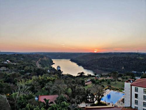 an aerial view of a river at sunset at O2 Hotel Iguazu in Puerto Iguazú