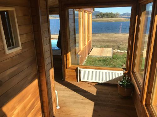 an open door of a house with a window at RELAX Guest House in Tsigov Chark