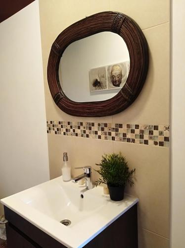 a bathroom with a sink and a mirror at Casa da Lameira in Serra