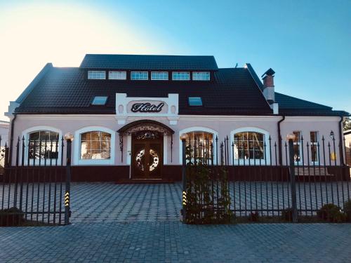 a building with a coca cola sign on it at Hotel Style BESSARABIA in Kiliya