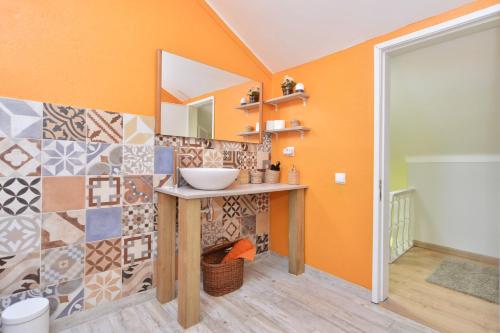 a bathroom with a sink and a mirror at Cascais Holiday House - Checkinhome in Cascais