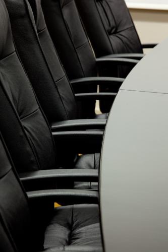 a row of black seats in a car at Avani Lesotho Hotel & Casino in Maseru
