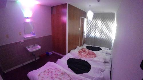 Katil atau katil-katil dalam bilik di Setouchi Triennale Hotel 402 Mysterious beauty Yugen / Vacation STAY 62365
