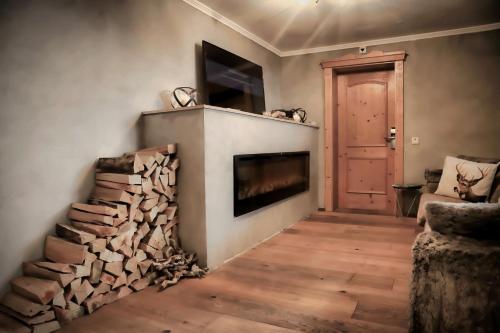a living room with a fireplace and a fire place at Chalet Madlein in Ischgl
