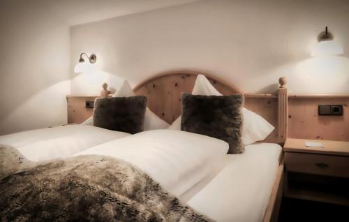 two beds sitting next to each other in a room at Chalet Madlein in Ischgl