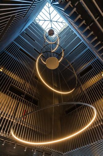 a row of lights on the ceiling of a building at Ola Santiago Providencia, Tapestry Collection by Hilton in Santiago