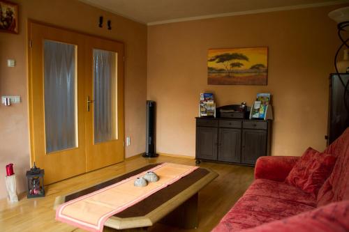 a living room with a couch and a coffee table at Ferienhaus Bogsi in Müllrose