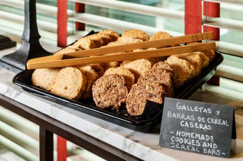 a display of breads and pastries on a counter at Hyatt Centric Las Condes Santiago in Santiago