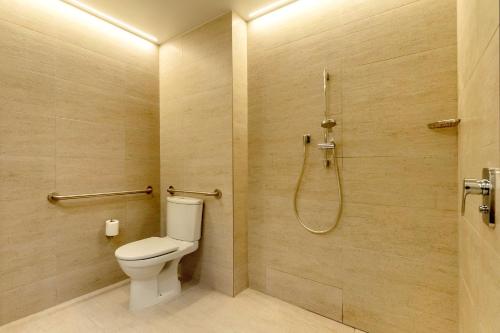 a bathroom with a toilet and a shower at Hyatt Centric Las Condes Santiago in Santiago